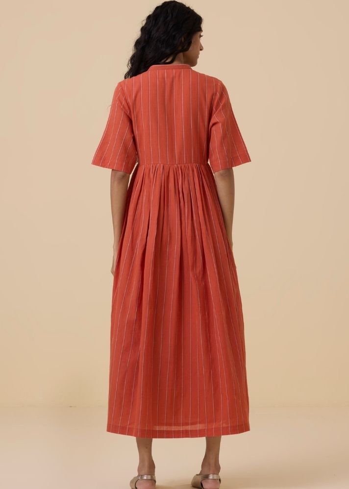 A Model Wearing Orange Handwoven Cotton Sabah Orange Cotton Striped Midi Dress , curated by Only Ethikal
