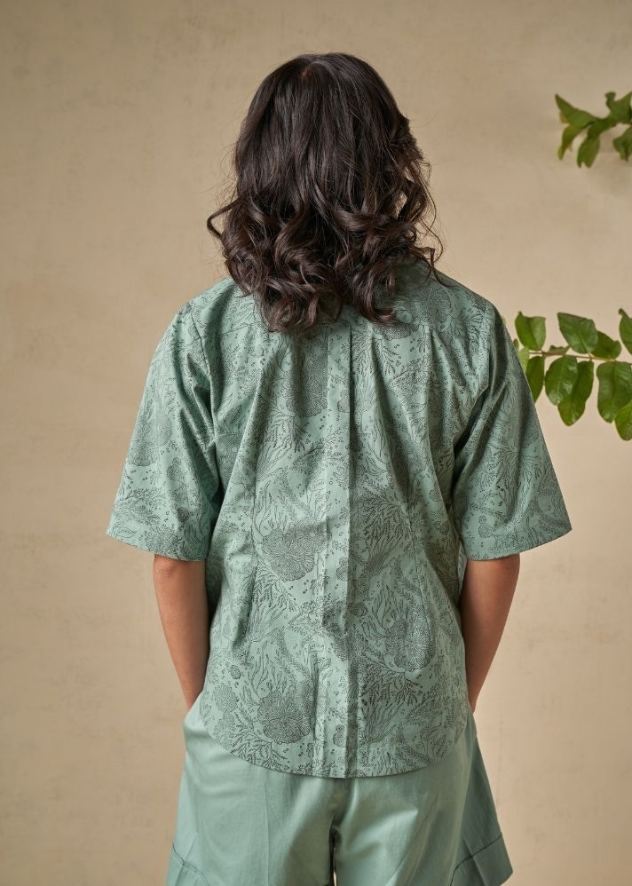 A Model Wearing Green Organic Cotton The Coral organic cotton shacket, curated by Only Ethikal