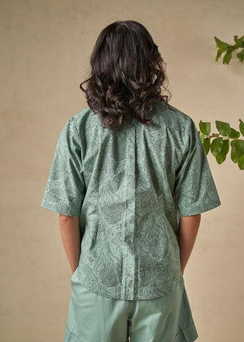 A Model Wearing Green Organic Cotton The Coral organic cotton shacket, curated by Only Ethikal