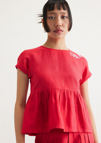 A Model Wearing Red Linen Slow Living Linen Peplum Top, curated by Only Ethikal