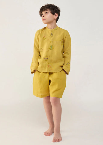 A Model Wearing Yellow Linen Kids Kei Timeless Linen Shorts- Ochre, curated by Only Ethikal