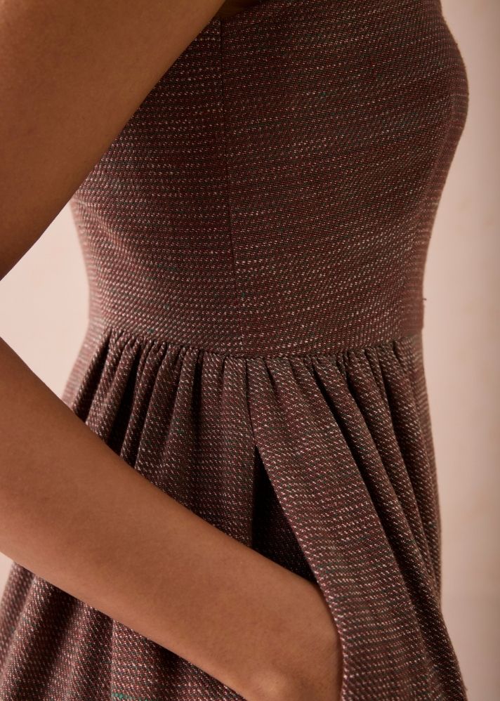A Model Wearing Brown Handwoven Cotton Hazel Sun Handspun Handwoven Organic Cotton Pleated Mini Dress, curated by Only Ethikal