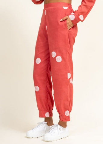 A Model Wearing Peach Upcycled Cotton Coral Tucked Pants, curated by Only Ethikal