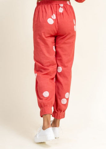 A Model Wearing Peach Upcycled Cotton Coral Tucked Pants, curated by Only Ethikal