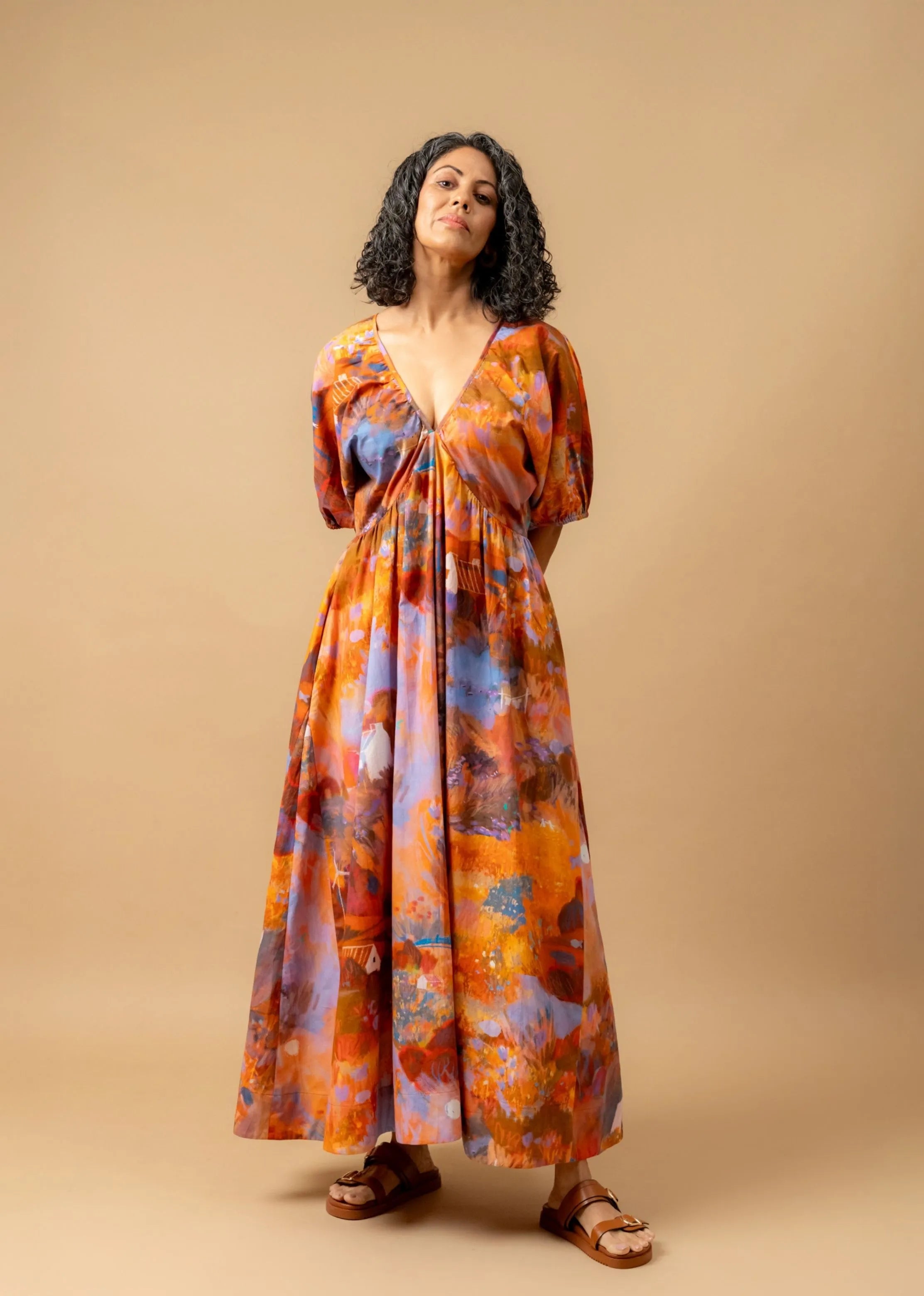 A Model Wearing Orange Organic Cotton Dewbell Printed Dress, curated by Only Ethikal