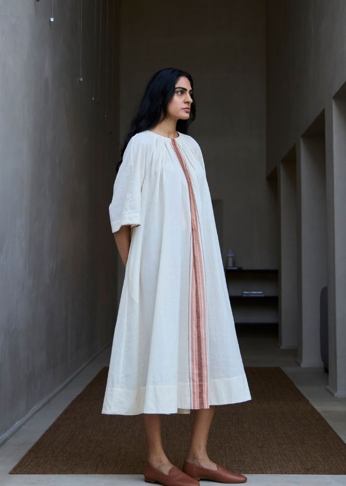 A Model Wearing White Handwoven Cotton Bulan Handwoven Striped Midi Dress , curated by Only Ethikal