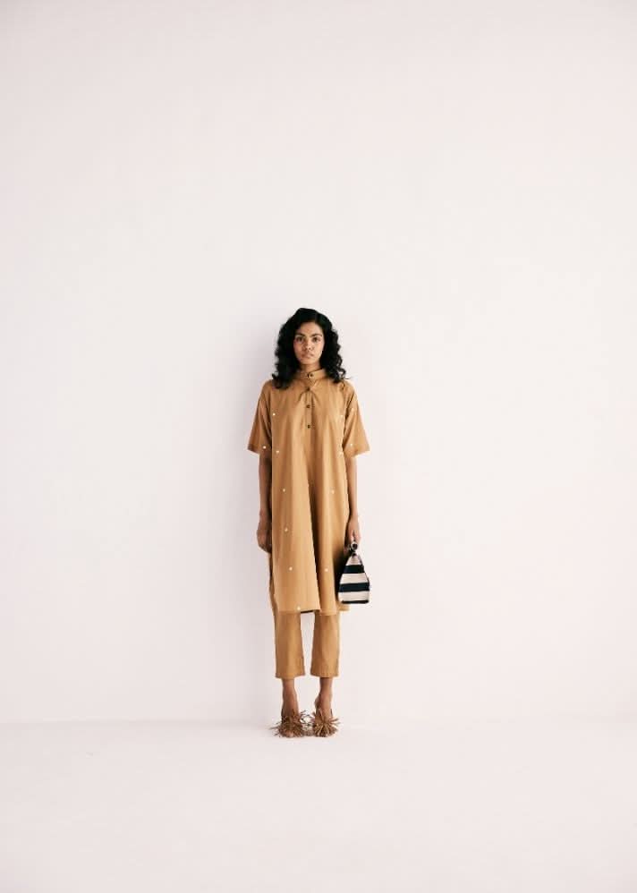 A Model Wearing Beige Cotton Mul Sand Kurta Set curated by Only Ethikal