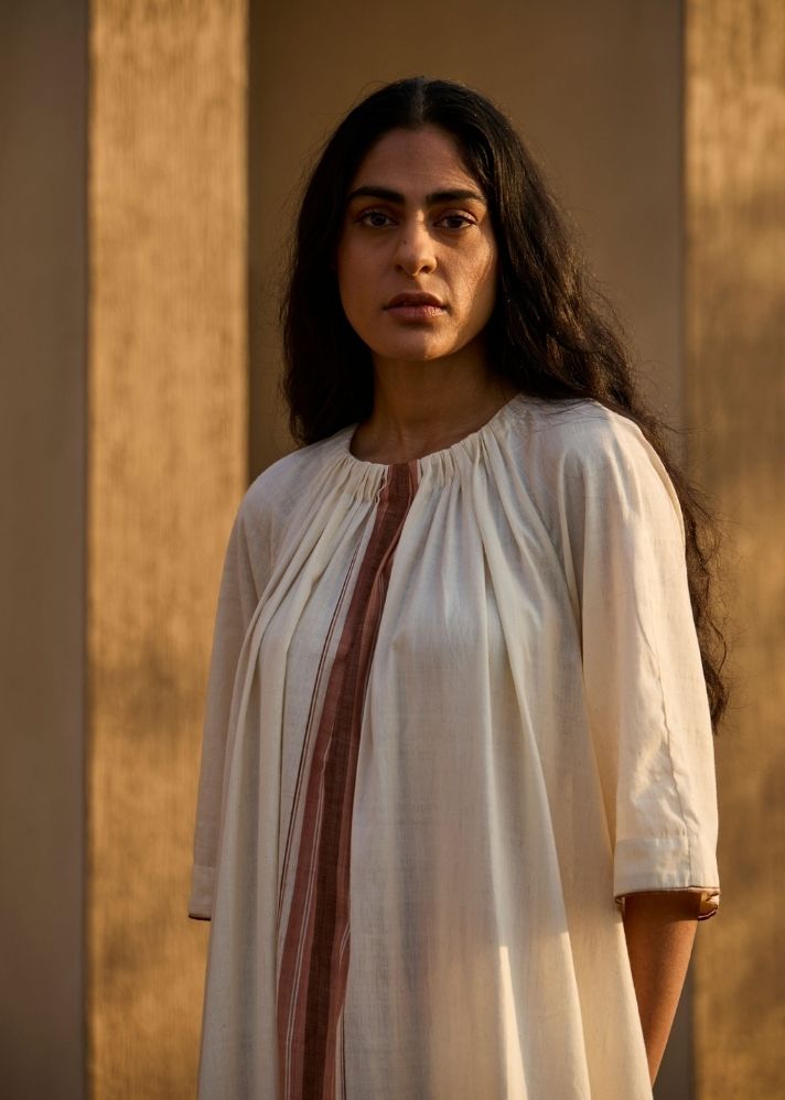 A Model Wearing White Handwoven Cotton Bulan Handwoven Striped Midi Dress , curated by Only Ethikal