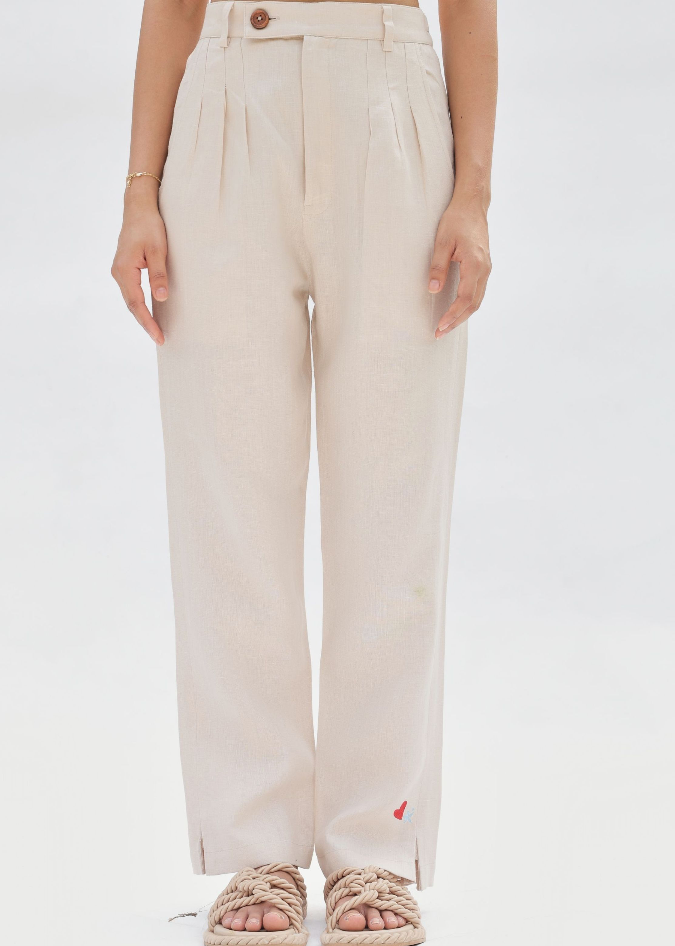 A Model Wearing Off White Linen Ocean Breeze Linen Trousers, curated by Only Ethikal