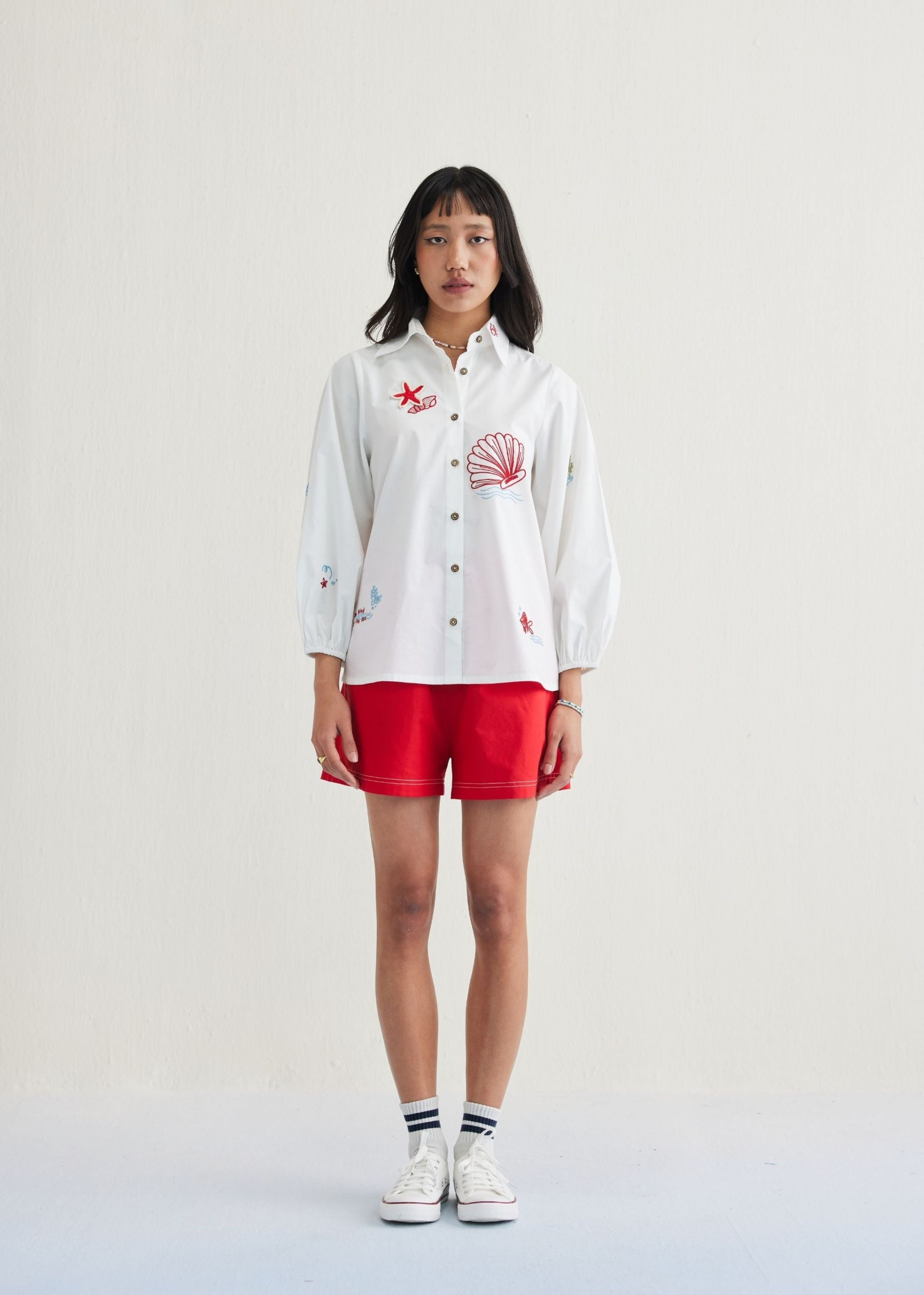 A Model Wearing White Organic Cotton By The Sea Organic Cotton Classic Shirt, curated by Only Ethikal