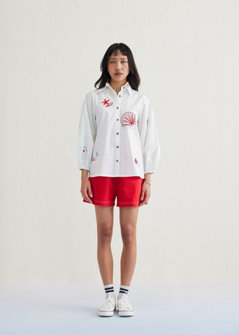 A Model Wearing White Organic Cotton By The Sea Organic Cotton Classic Shirt, curated by Only Ethikal
