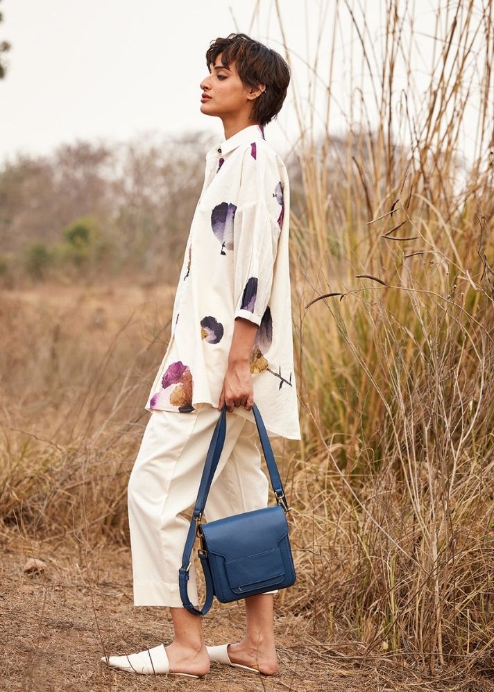 A Model Wearing White Cotton Mul Cascade fling Pants,curated by Only Ethikal