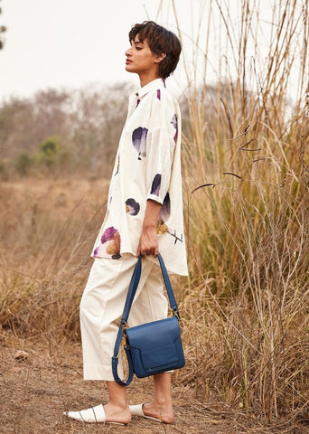 A Model Wearing White Cotton Mul Cascade fling Pants,curated by Only Ethikal
