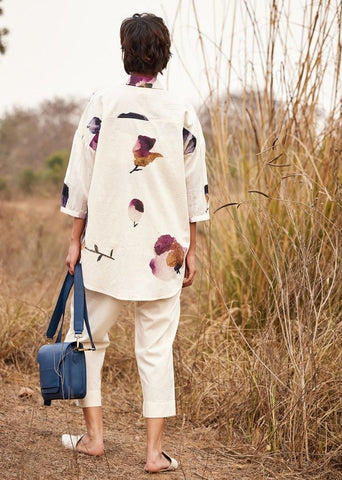 A Model Wearing White Cotton Mul Cascade fling Pants,curated by Only Ethikal