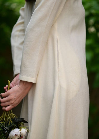 A Model Wearing White Wool White Starflowerdress , curated by Only Ethikal