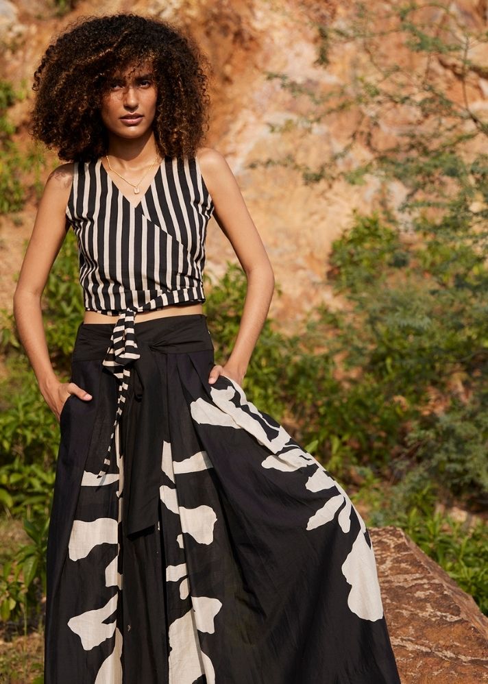 A Model Wearing Black Pure Cotton Desire of Elixir Pleated Trouser curated by Only Ethikal