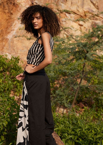 A Model Wearing Black Pure Cotton Desire of Elixir Pleated Trouser curated by Only Ethikal