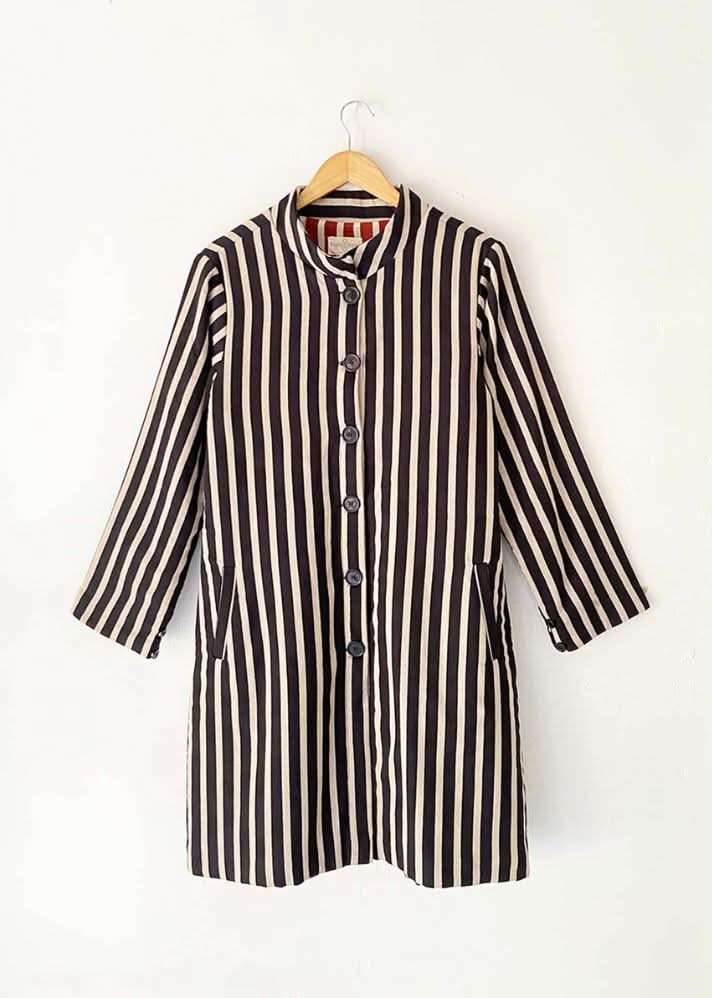 A Model Wearing Black Warm sandwich fabric Illusion Reversable Jacket curated by Only Ethikal