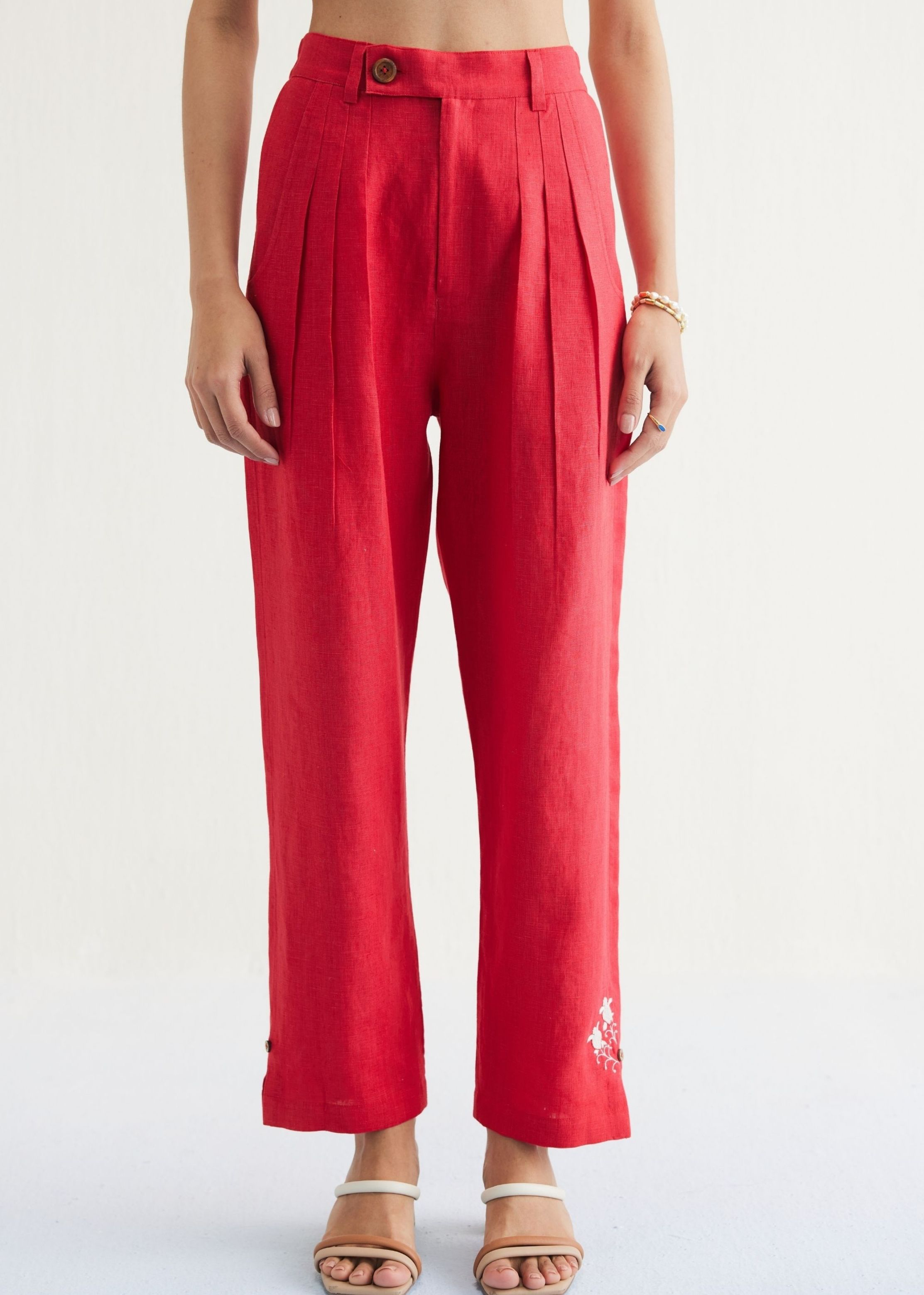 A Model Wearing Red Linen Ebb & Flow Sunset Linen Trousers, curated by Only Ethikal