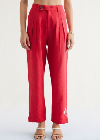A Model Wearing Red Linen Ebb & Flow Sunset Linen Trousers, curated by Only Ethikal