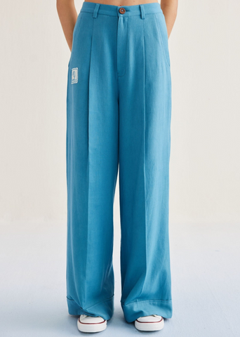A Model Wearing Blue Cotton Twill Meet Me By The Sea Handwoven Twill Trousers, curated by Only Ethikal