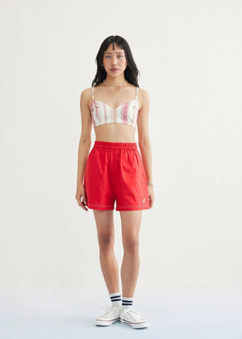 A Model Wearing Red Organic Cotton Seashell Summer Organic Cotton Classic Shorts, curated by Only Ethikal