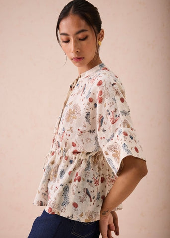 A Model Wearing White Handwoven Cotton Rustic Beginnings Handspun Handwoven Organic Cotton Peplum Top, curated by Only Ethikal