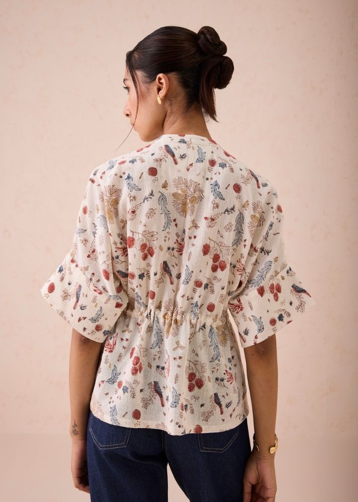 A Model Wearing White Handwoven Cotton Rustic Beginnings Handspun Handwoven Organic Cotton Peplum Top, curated by Only Ethikal