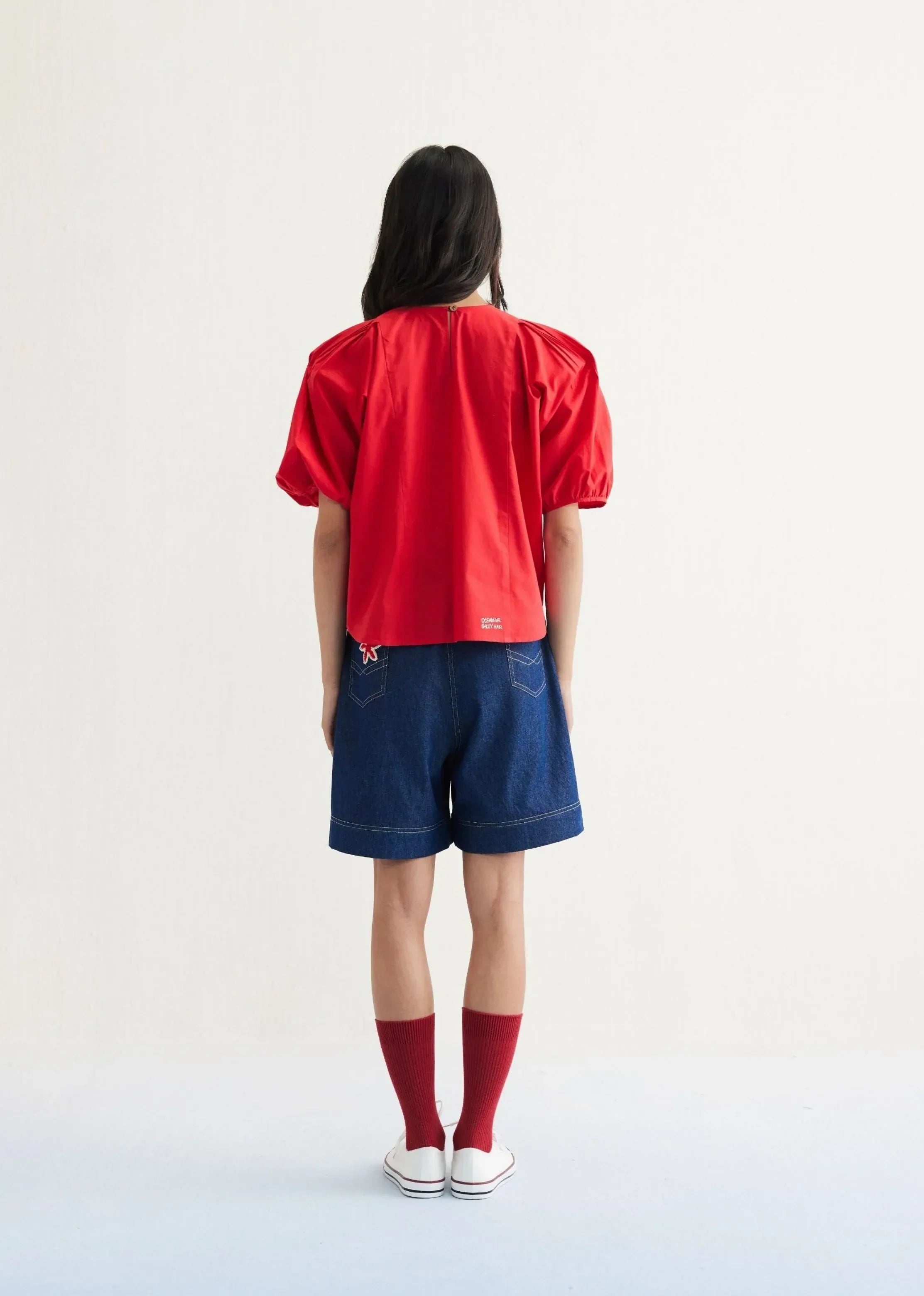 A Model Wearing Red Organic Cotton Ocean Air Organic Cotton Red Top, curated by Only Ethikal