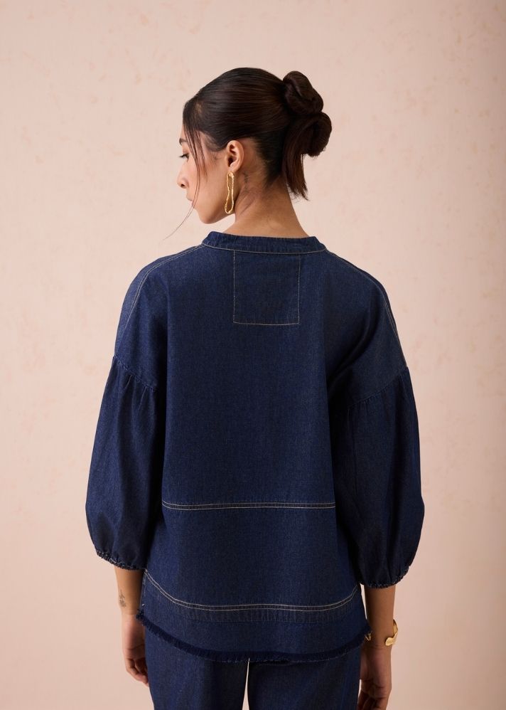 A Model Wearing Blue Denim The Little Things Denim Blouse, curated by Only Ethikal