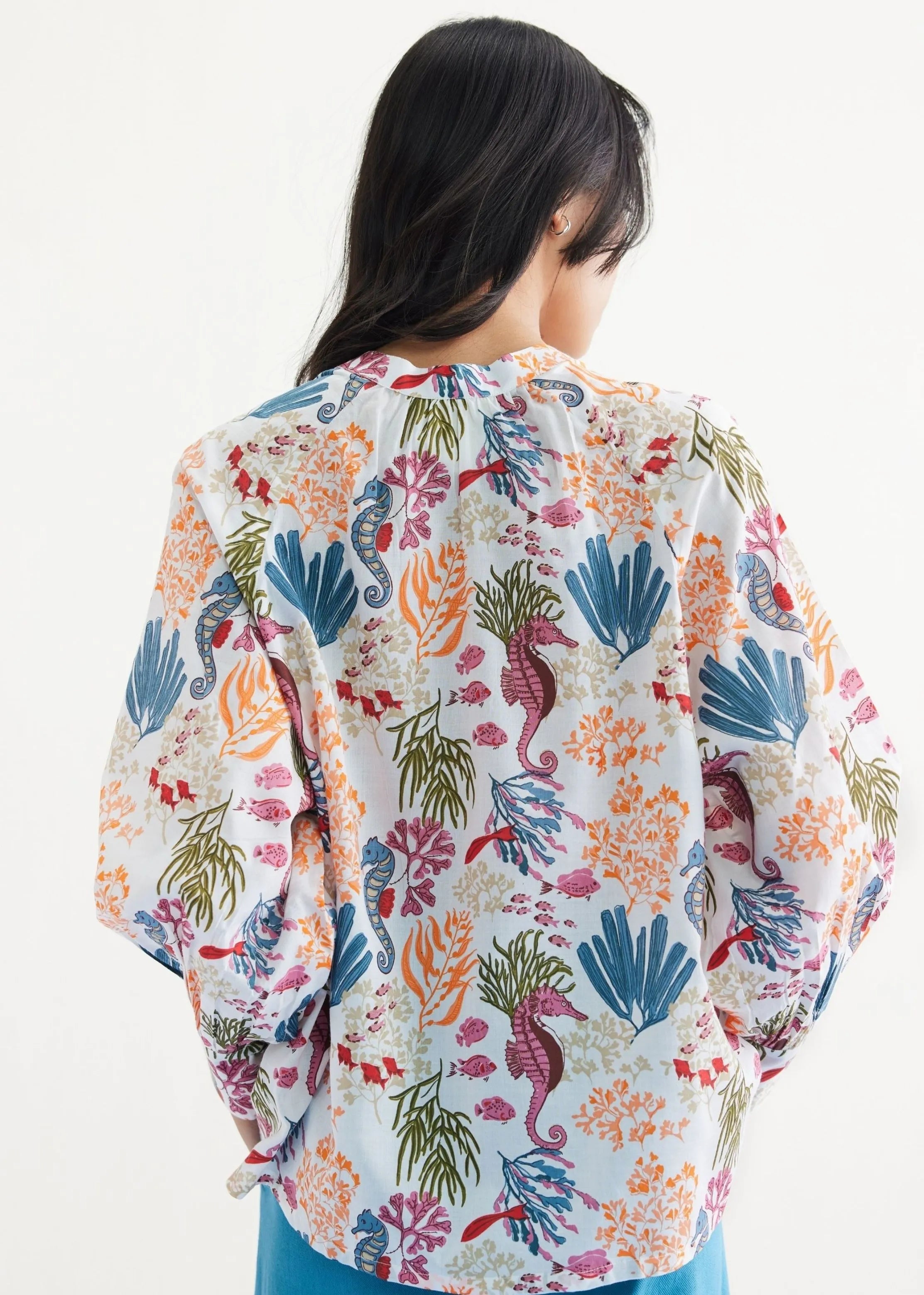 A Model Wearing White Lyocell Blooming Reef Lyocell Classic White Shirt, curated by Only Ethikal