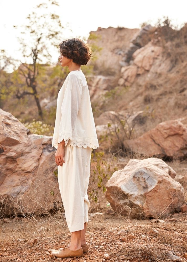 A Model Wearing White Cotton Mul Shuchi Salwar Pants,curated by Only Ethikal