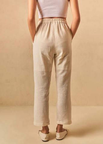 A Model Wearing Beige Organic Cotton The Holiday handwoven trousers, curated by Only Ethikal