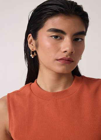A Model Wearing Orange Organic Cotton Iga Orange Cotton Tank Top , curated by Only Ethikal