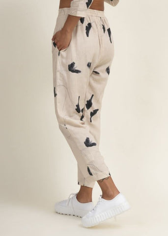 A Model Wearing Multicolor Upcycled Cotton Tapered Printed Pants, curated by Only Ethikal