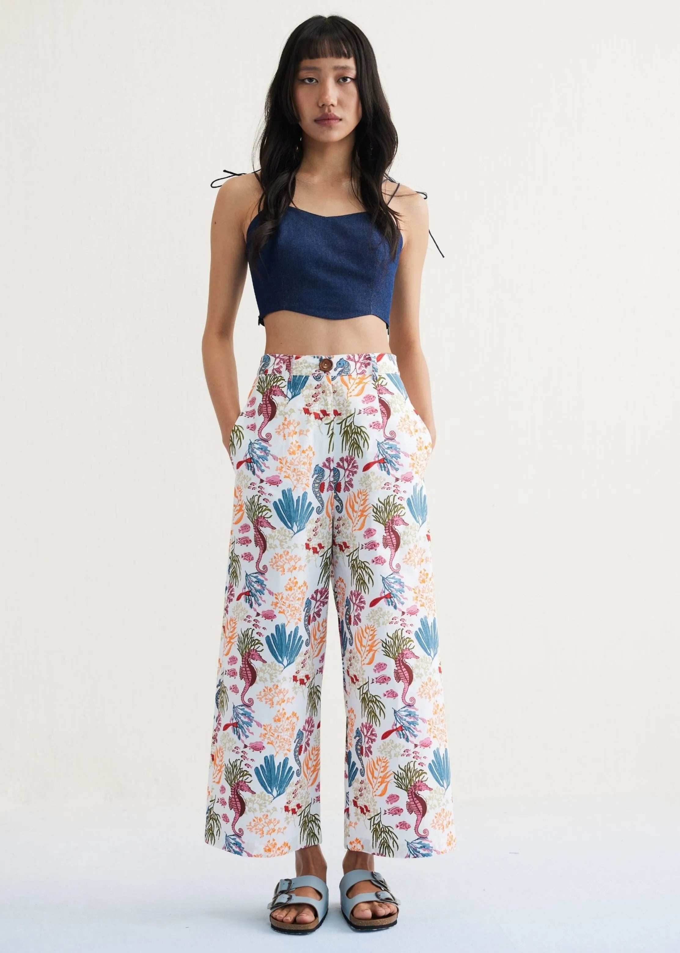A Model Wearing White Organic Cotton The Seahorse Organic Cotton White Trousers, curated by Only Ethikal