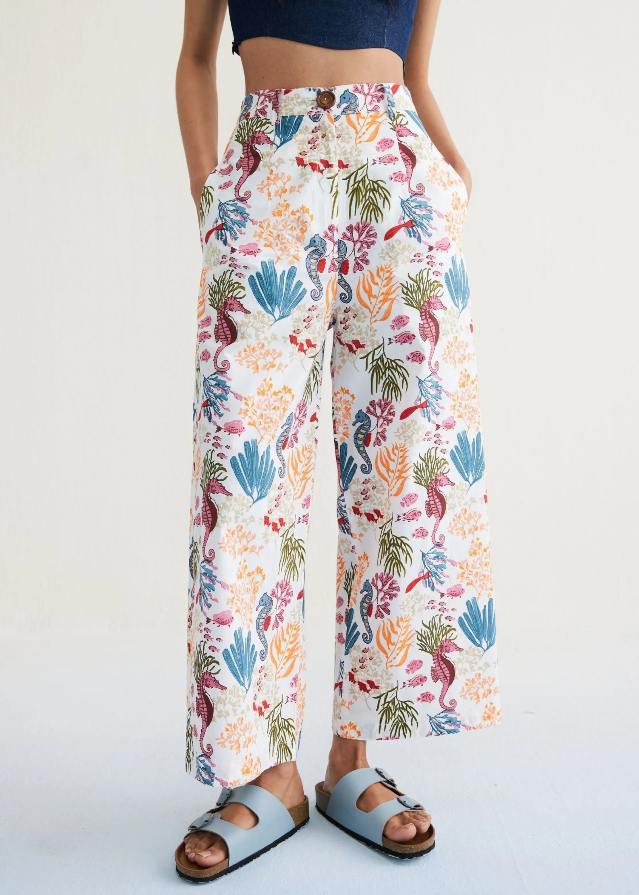 A Model Wearing White Organic Cotton The Seahorse Organic Cotton White Trousers, curated by Only Ethikal