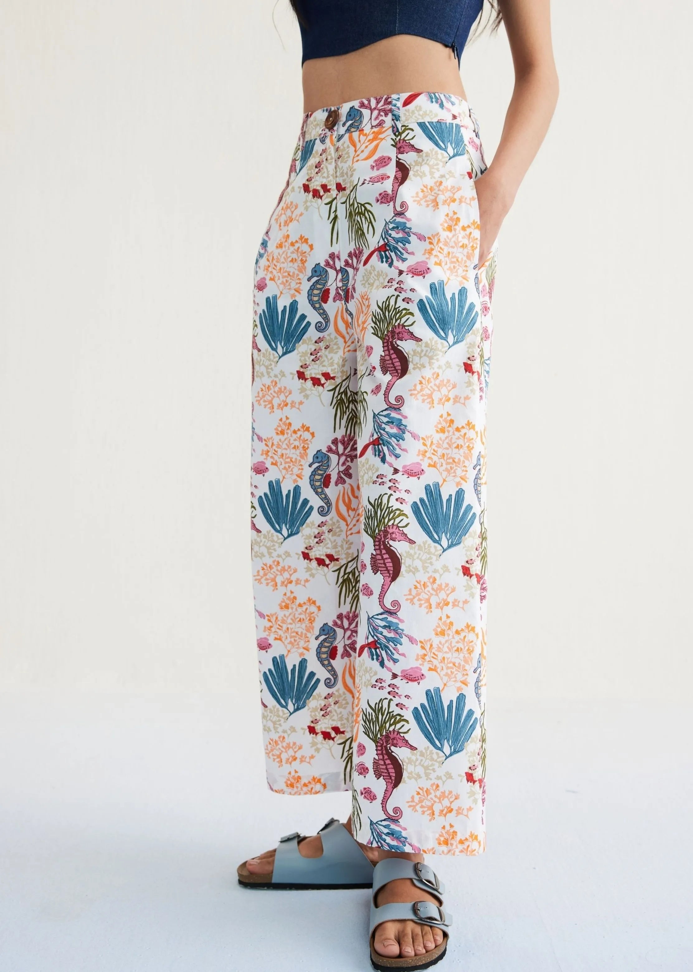 A Model Wearing White Organic Cotton The Seahorse Organic Cotton White Trousers, curated by Only Ethikal