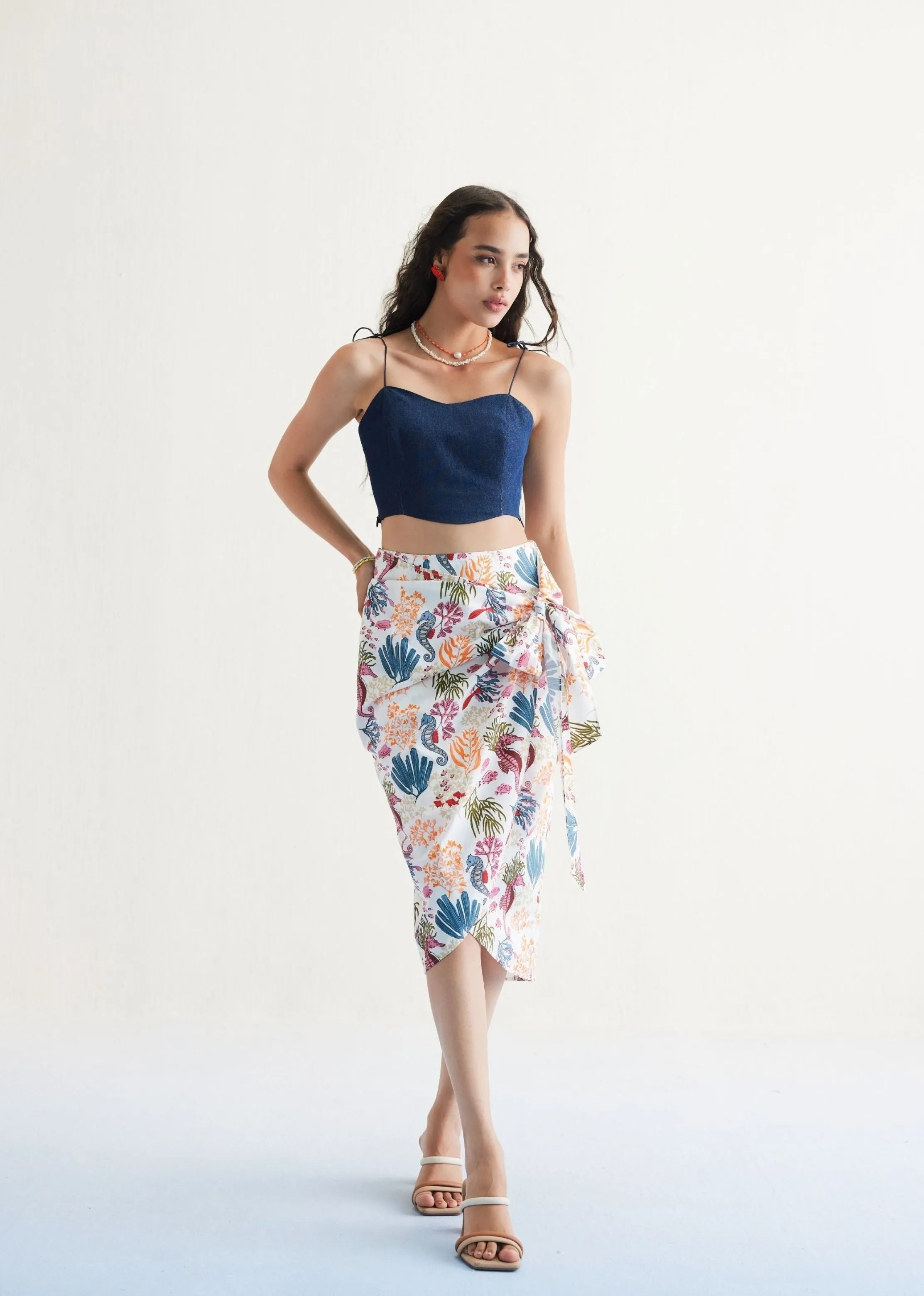 A Model Wearing White Organic Cotton Blooming Reef Cotton White Wrap Skirt, curated by Only Ethikal