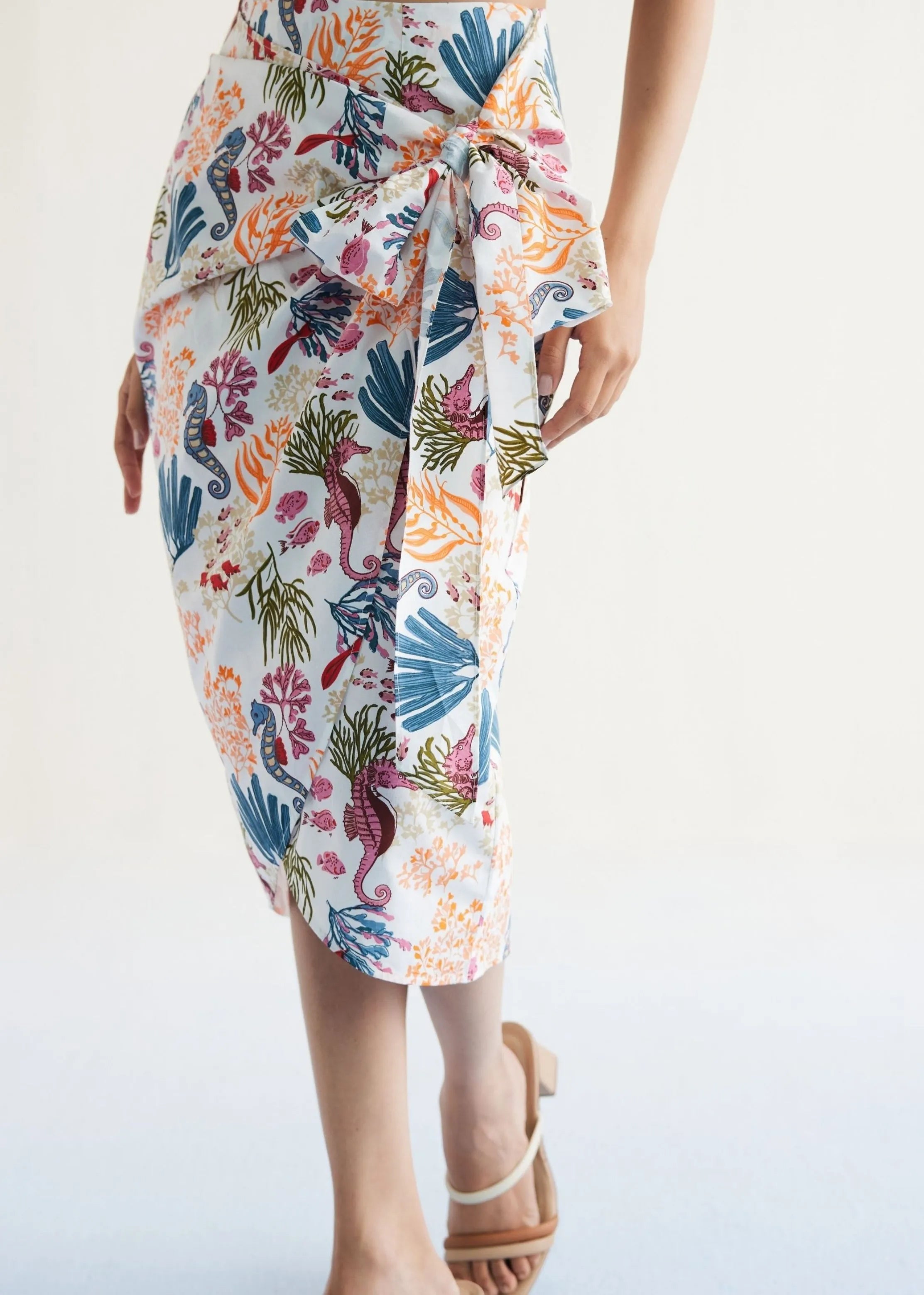 A Model Wearing White Organic Cotton Blooming Reef Cotton White Wrap Skirt, curated by Only Ethikal