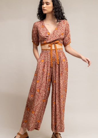 A Model Wearing Brown Upcycled Cotton  Rehno Printed Trousers, curated by Only Ethikal