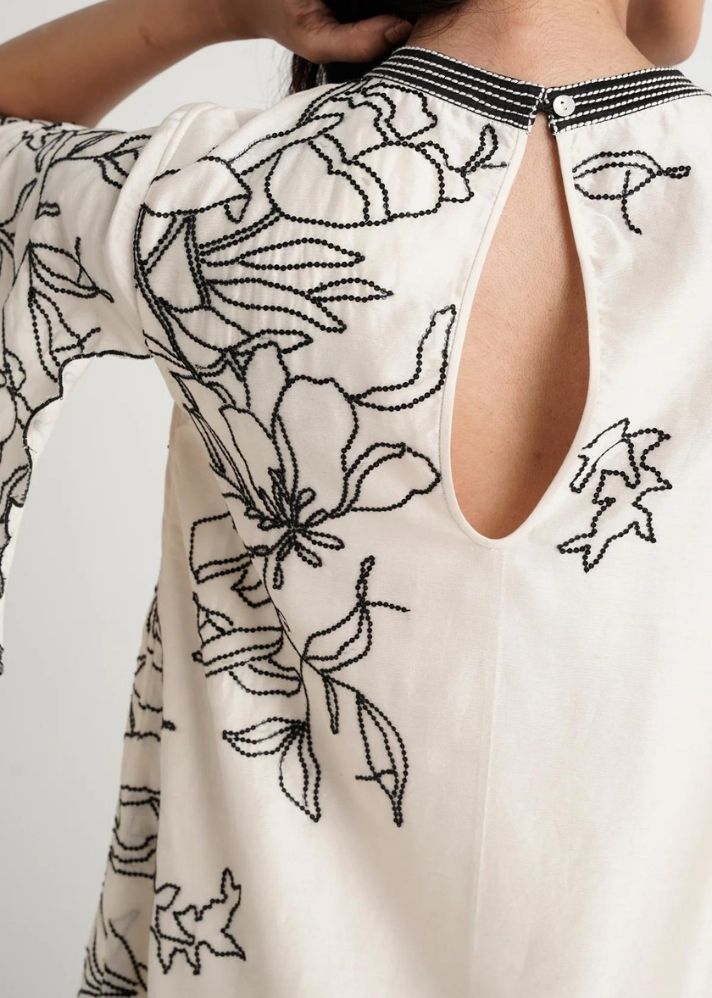 A Model Wearing White Pure Cotton Leo Short Dress, curated by Only Ethikal