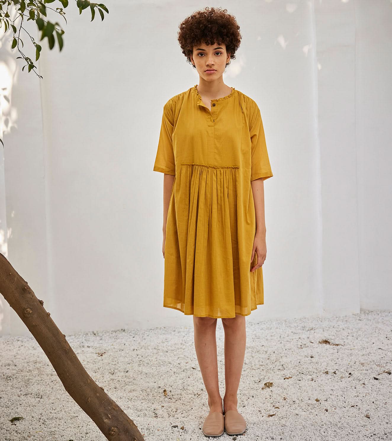A Model Wearing Yellow Pure Cotton Love Burns Dress curated by Only Ethikal