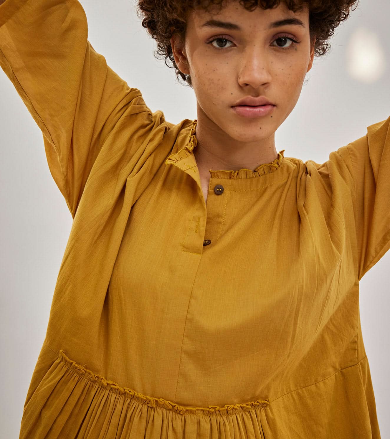 A Model Wearing Yellow Pure Cotton Love Burns Dress curated by Only Ethikal