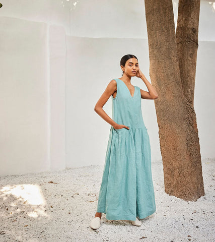 A Model Wearing Blue Linen Morning SkyJumpsuit,curated by Only Ethikal