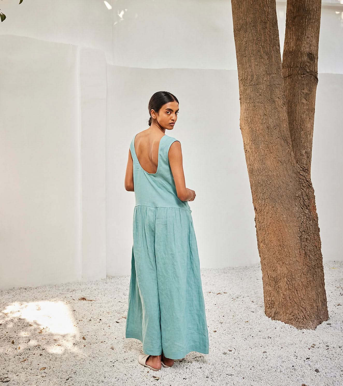 A Model Wearing Blue Linen Morning SkyJumpsuit,curated by Only Ethikal