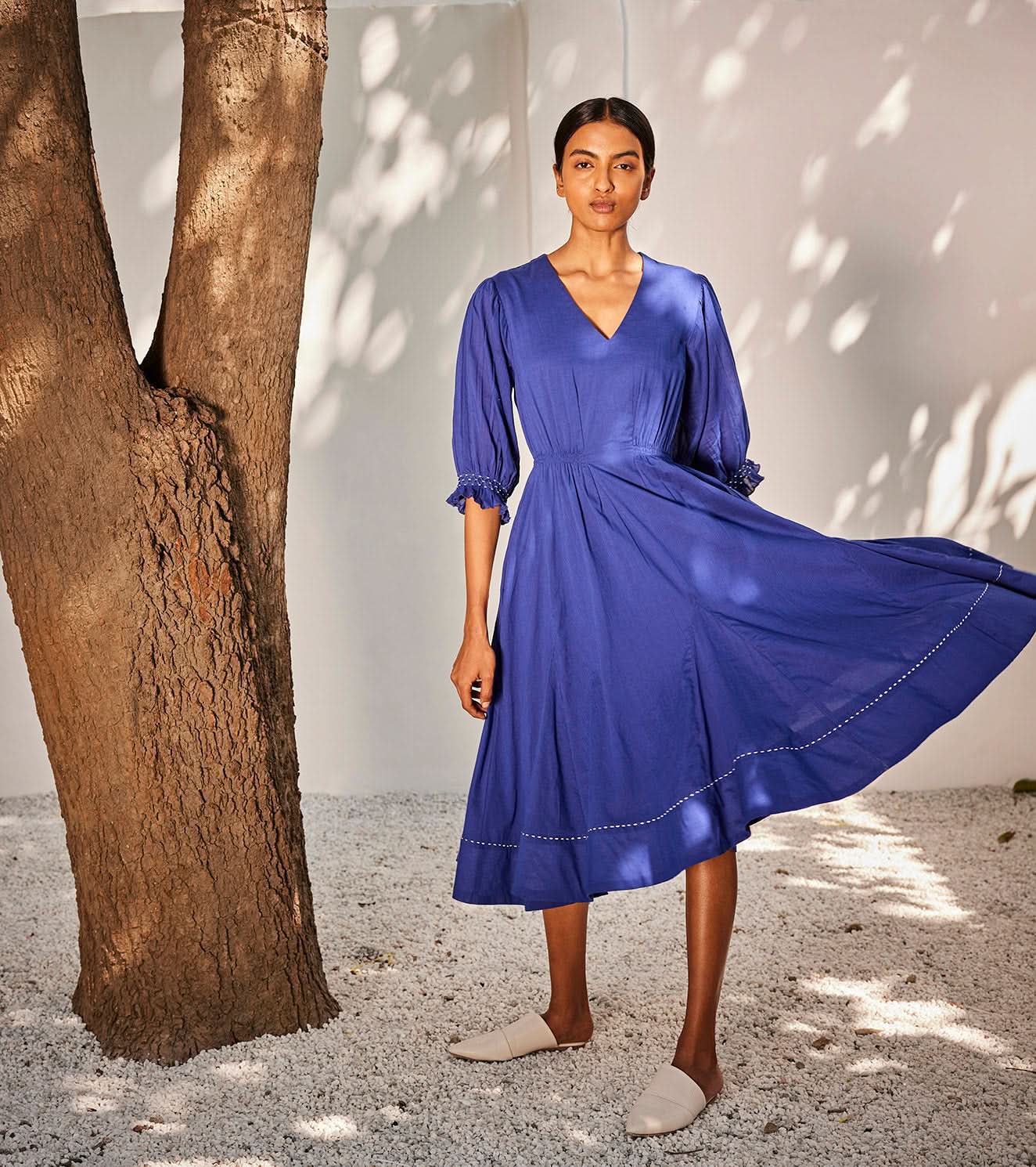 A Model Wearing Blue Pure Cotton Bustling Wind Dress curated by Only Ethikal