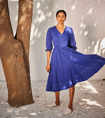 A Model Wearing Blue Pure Cotton Bustling Wind Dress curated by Only Ethikal