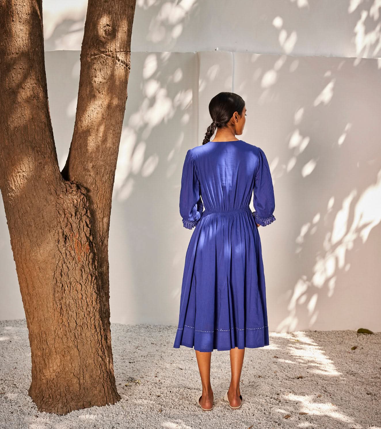 A Model Wearing Blue Pure Cotton Bustling Wind Dress curated by Only Ethikal