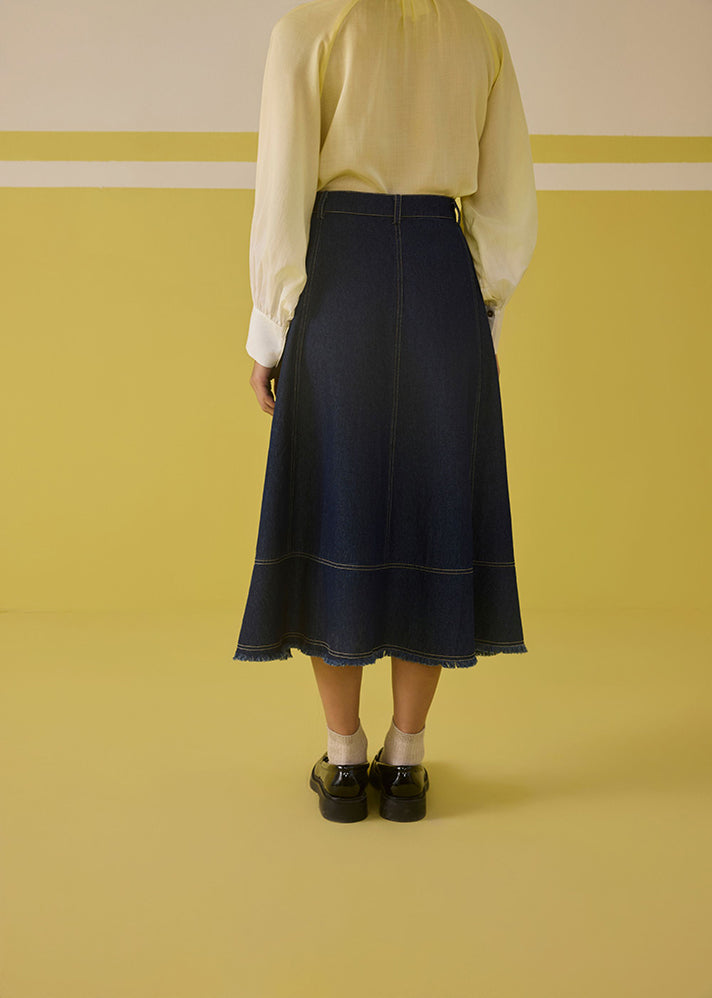 A Model Wearing Organic Cotton Denim The Sunshine Denim Skirt, curated by Only Ethikal
